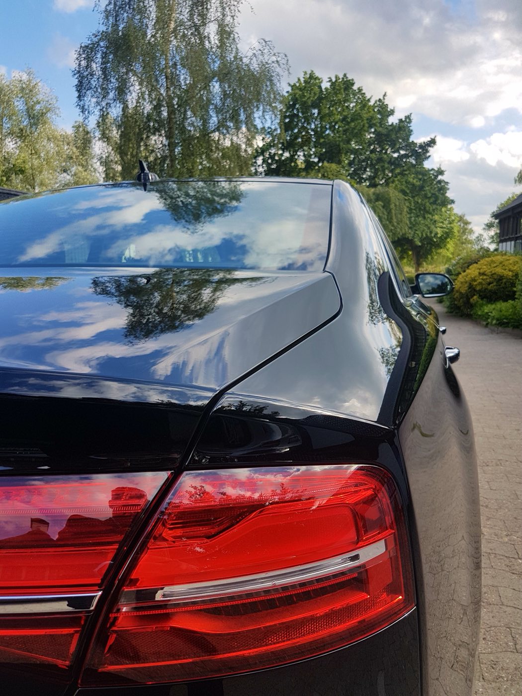 Rear of a black executive saloon used for fixed-fare London taxi and airport transfers by Airport Move